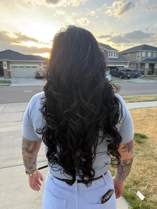 Full body shot of 26 inches of keratin extension bonds. Medium black, bouncy, full, and gorgeous.